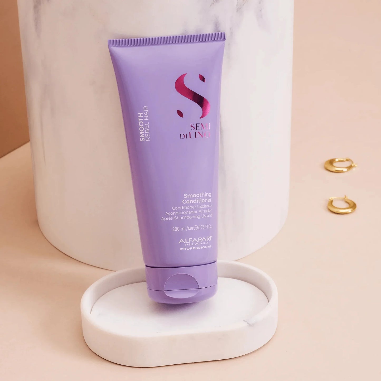 Purple Alfaparf Semi Di Lino Smoothing Conditioner 200ml tube on marble tray, minimal background